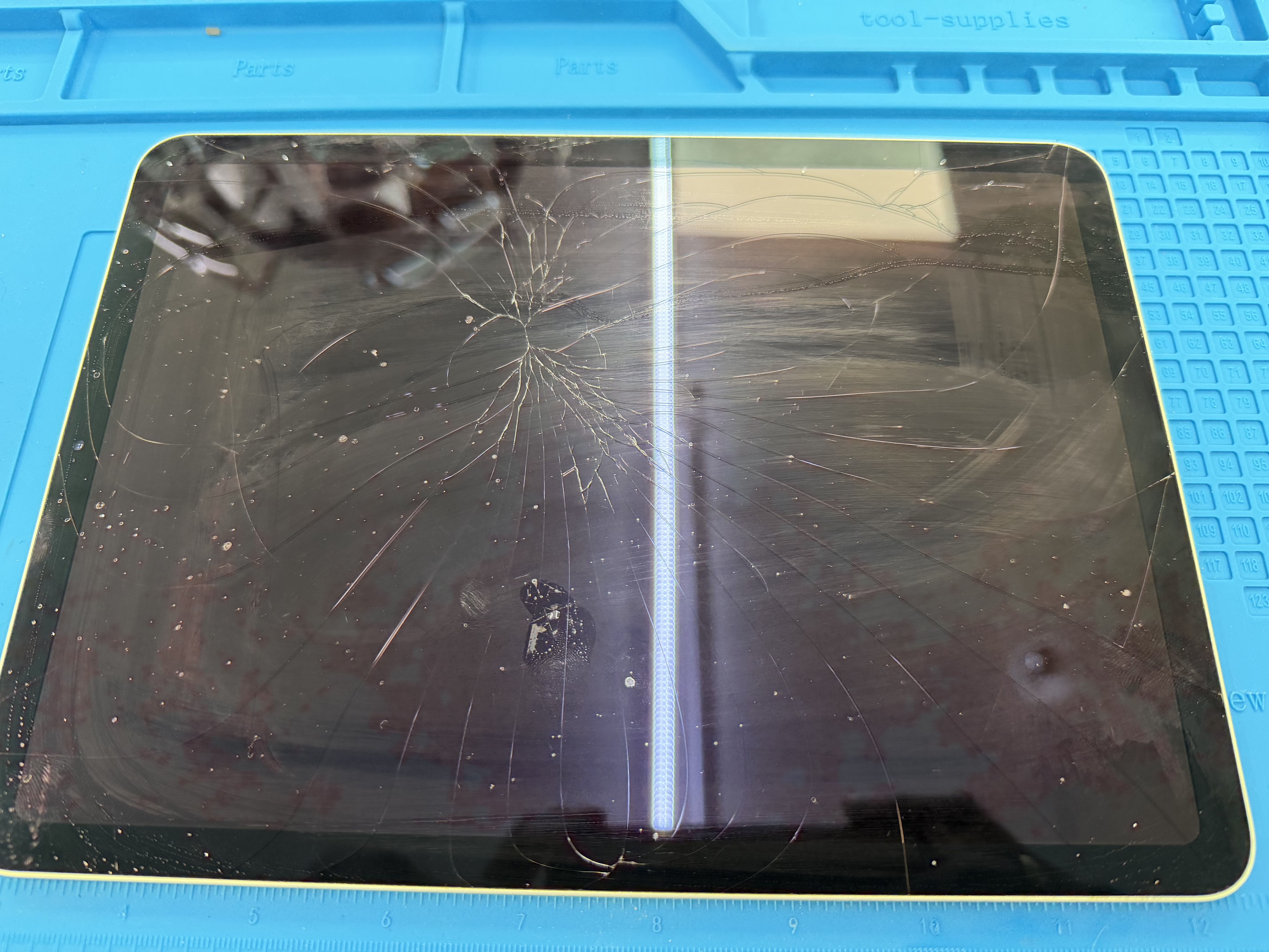 Cracked iPad screen brought in for repair at Fixtronics NYC